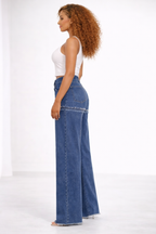 JEANS AMPLE À OURLET EFFILOCHÉ